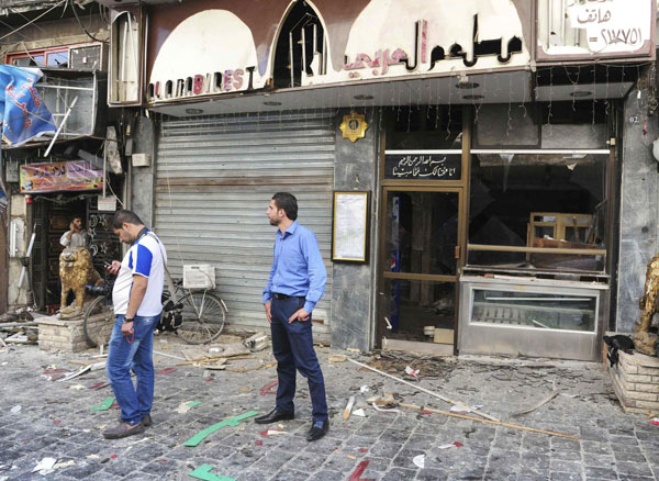 Twin blasts kill 14 in central Damascus