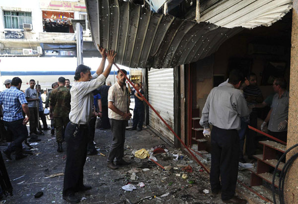 Twin blasts kill 14 in central Damascus