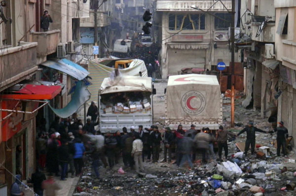 Aid truckloads enter Syria's besieged Homs