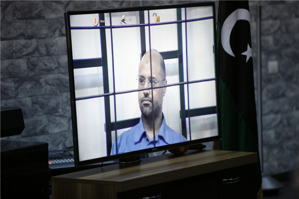 Gaddafi's son Saif faces charges in Tripoli court