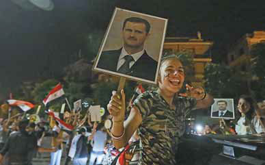 Assad secures victory in poll condemned by foes