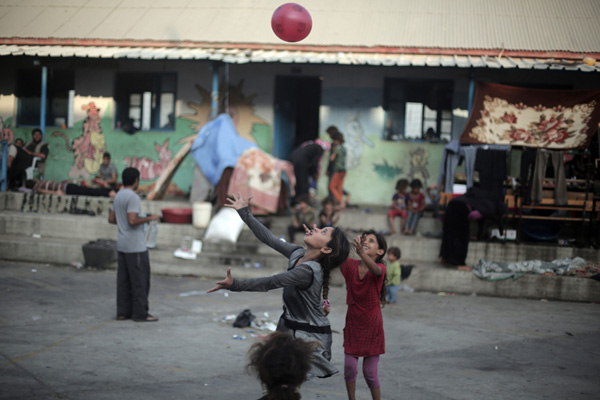 Palestinian children celebrate Eid al-Fitr in refuge camp