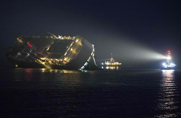 8 missing after cargo ship capsizes off Scotland