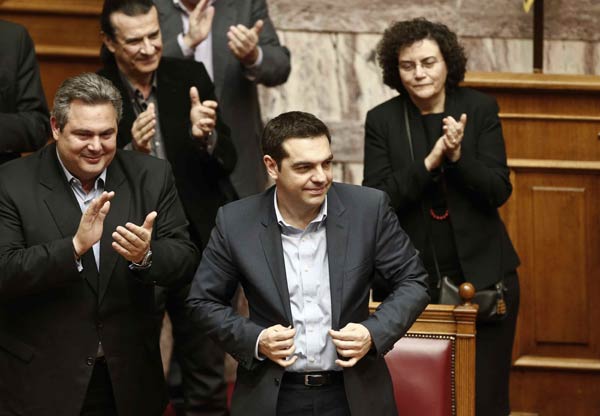 Greek PM easily wins confidence vote, EU showdown looms