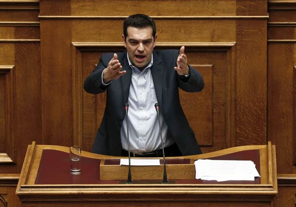 Greek PM easily wins confidence vote, EU showdown looms