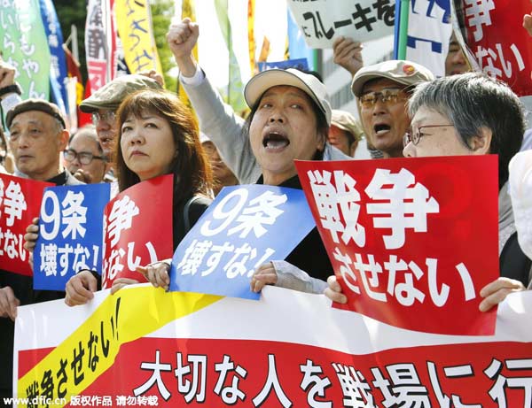 Hundreds of people gather in Tokyo to protest against security bills