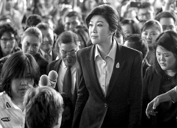 Foreign travel ban placed on Yingluck as trial starts