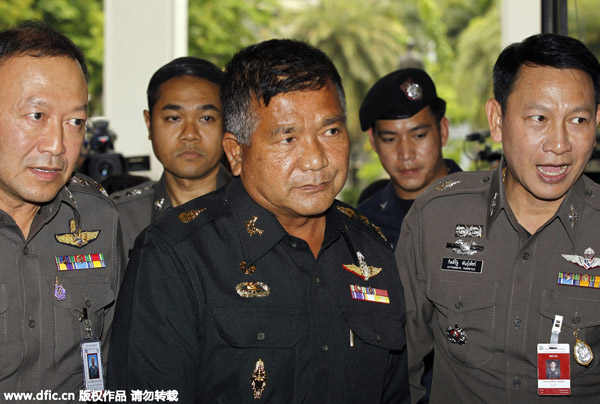 Thai army general surrenders to police over migrants trafficking