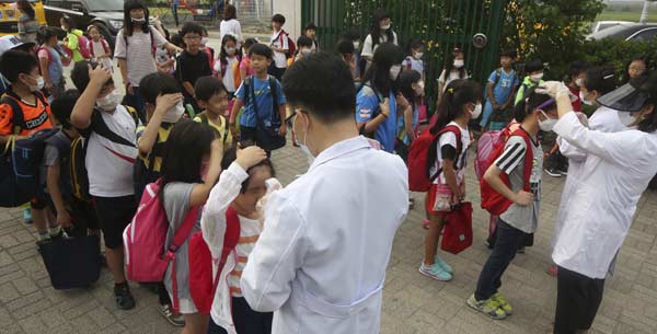 Schools reopen as South Korea seeks normality amid MERS outbreak