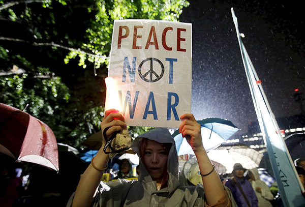 Japan enacts new security laws to overturn postwar pacifism
