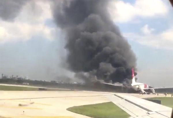 Passenger plane catches fire on tarmac in Florida airport