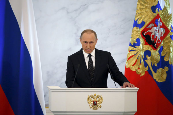 Putin sees positive trends in Russia's economy, warns of lower oil prices
