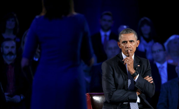 Obama defends gun-control measures in town hall event