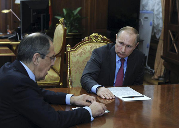 Putin says Russians to start withdrawing from Syria, as peace talks resume