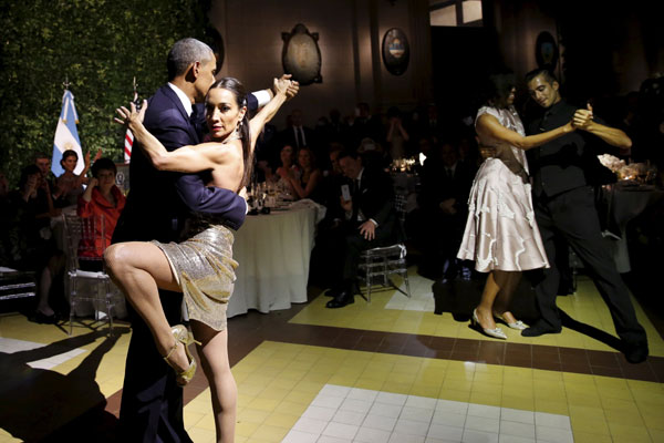 Obama dances tango during a state dinner in Argentina
