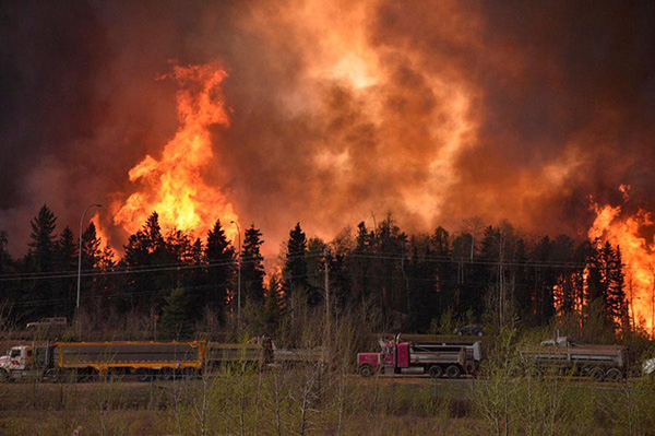 Epic wildfire threatens to engulf Canadian city as 88,000 flee