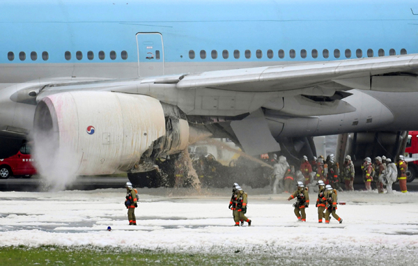 Korean Air plane terminates takeoff after engine catches fire