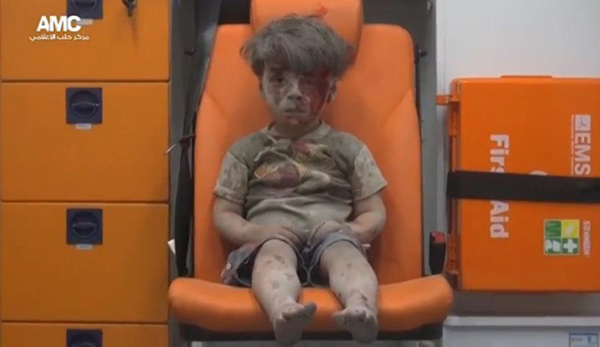 Harrowing video shows dazed, bloodied boy pulled from Aleppo rubble