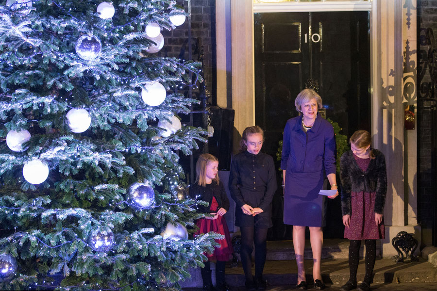 British PM lights Downing Street Christmas tree with local children