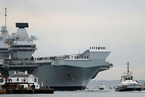 UK's biggest warship HMS Queen Elizabeth sails into home port for first time