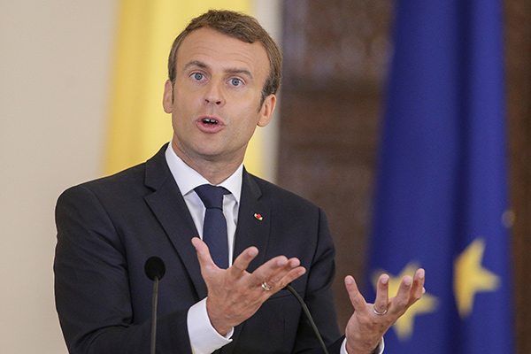 Macron confident of 'posted' workers deal after meeting Romanian president