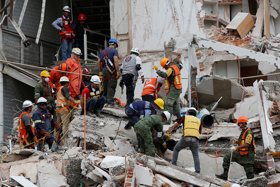 Mexicans dig through collapsed buildings as quake kills 225
