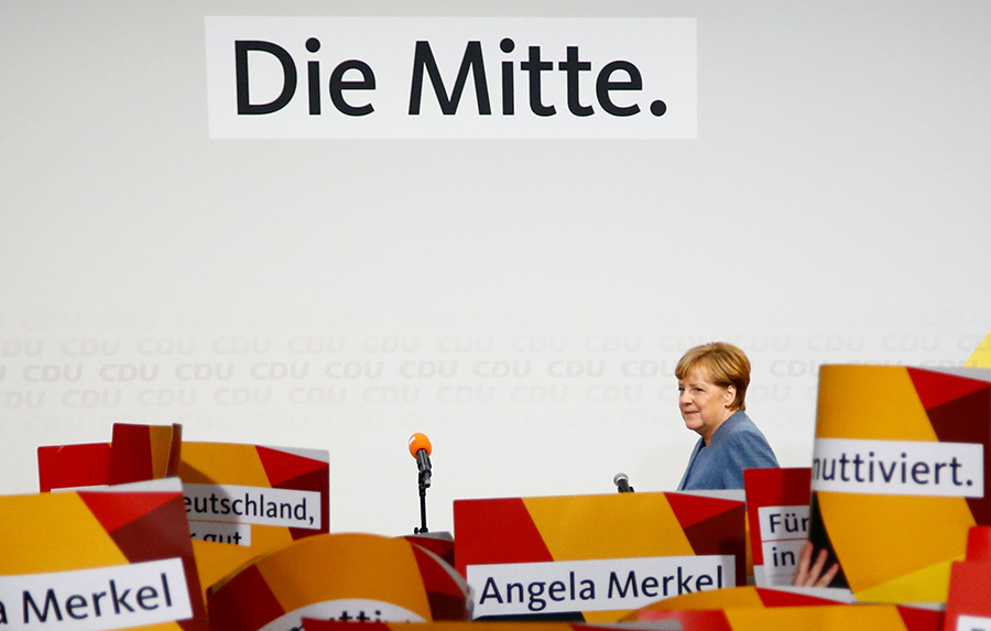 Merkel wins 4th term but nationalists surge in German vote