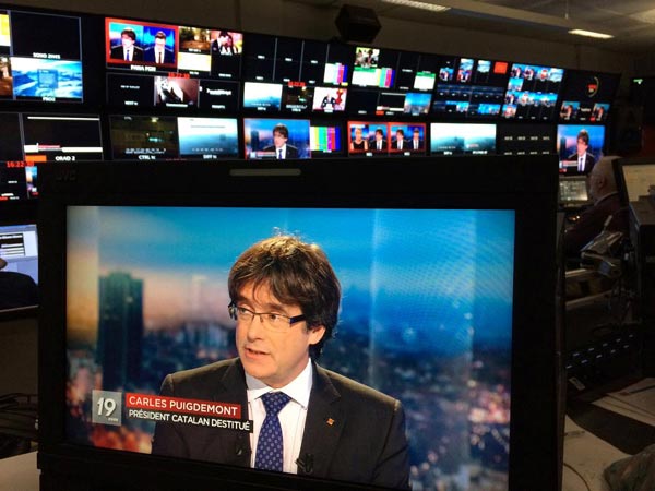 Ousted Catalan president Carles Puigdemont turned himself in to Belgian police