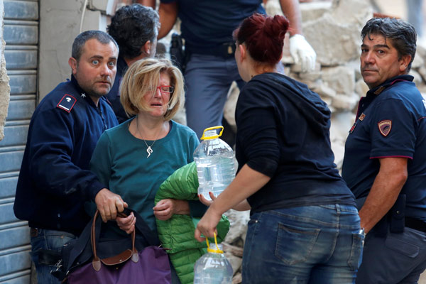 'Voices under the rubble' after quake hits Italy; at least 73 dead